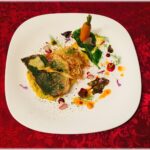 File de dorada servit, piure de porumb, pastarnac, pudra de patrunjel, ulei aromatizat, chilli